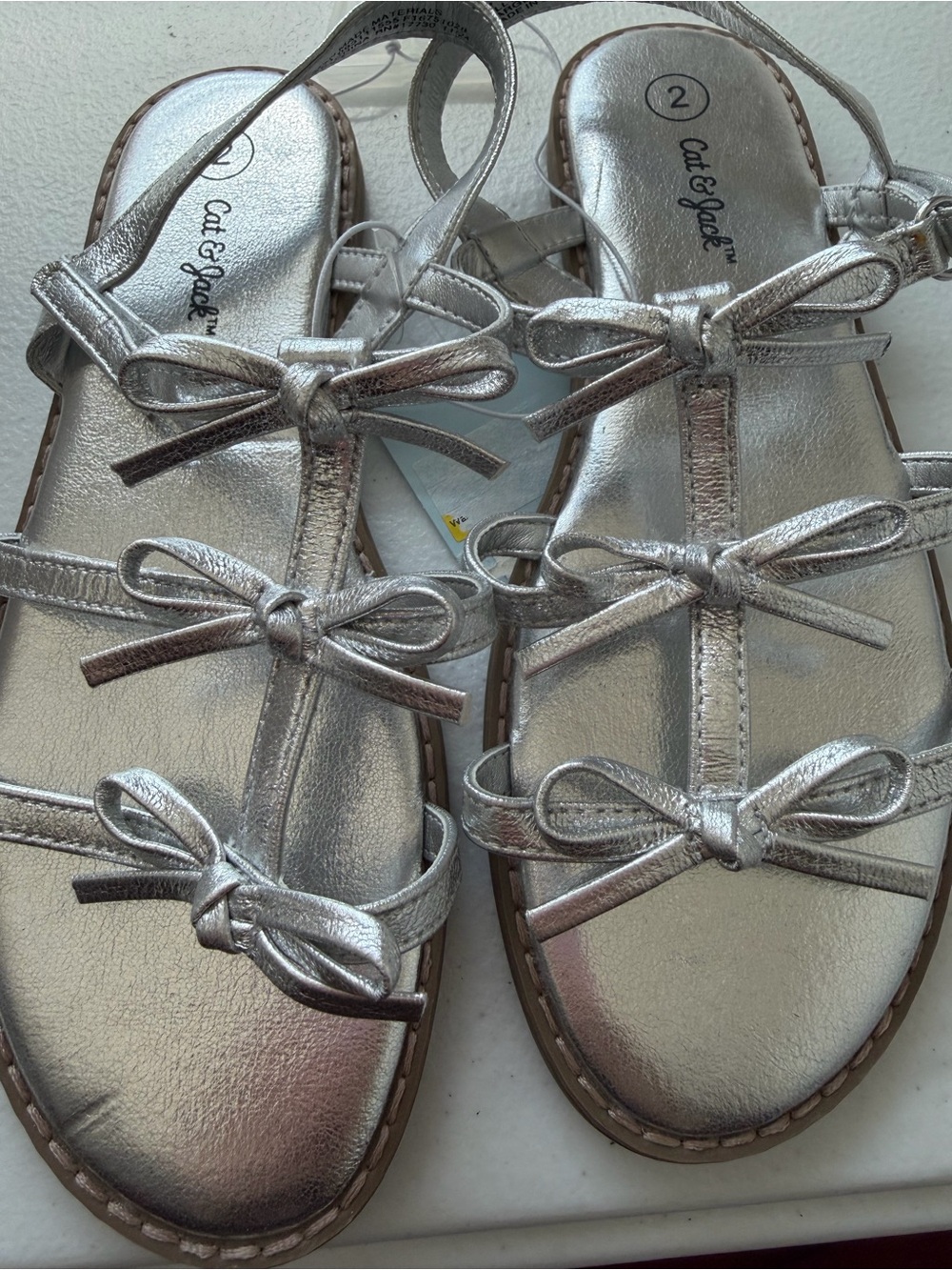 Silver Jeans Metallic Silver Bow T-Strap Women's Sandals